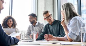 Diverse group meeting and smiling at business meeting