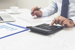 Office worker using a calculator